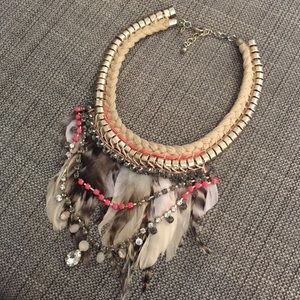 Statement necklace with crystals and feathers